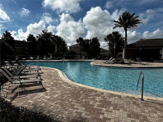 view of swimming pool featuring a patio area