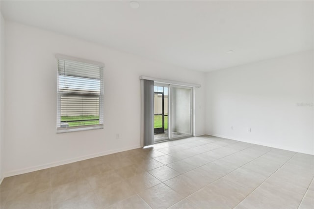 unfurnished room with light tile patterned floors