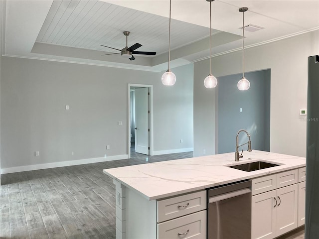 kitchen featuring a tray ceiling, sink, white cabinets, light stone countertops, and ceiling fan