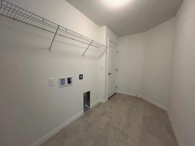 clothes washing area featuring laundry area, washer hookup, electric dryer hookup, and baseboards