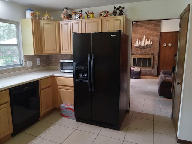 kitchen with decorative backsplash, light tile patterned floors, light brown cabinets, and black appliances