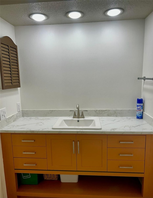 bathroom featuring vanity and a textured ceiling