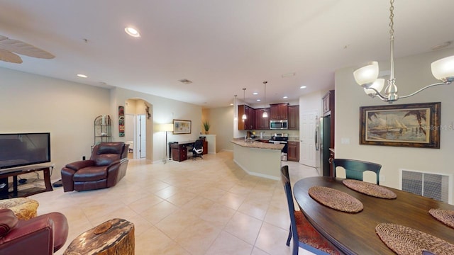 dining space with a notable chandelier