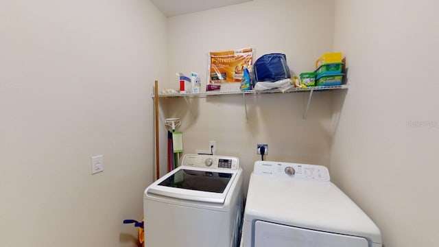 laundry room featuring washer and clothes dryer