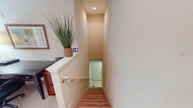 staircase with tile patterned floors