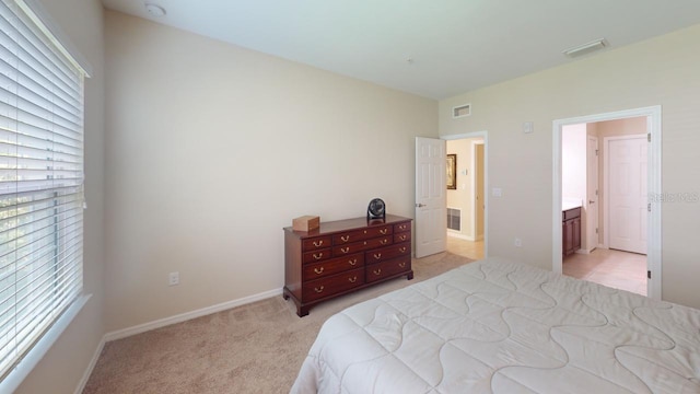 carpeted bedroom with multiple windows