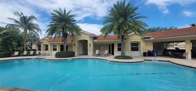 view of swimming pool with a patio