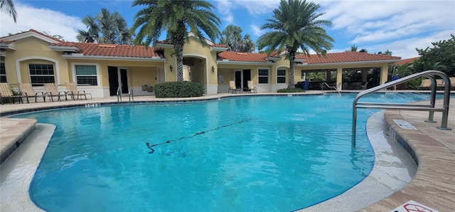 view of swimming pool with a patio