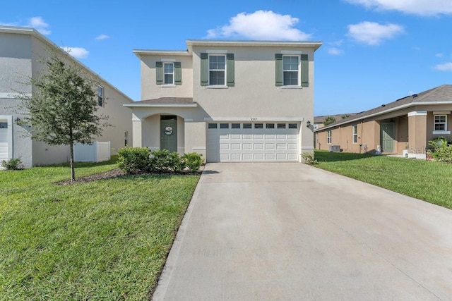 2557 Shamrock St, Tavares, FL 32778 - traditional-style home featuring stucco siding, an attached garage, driveway, and a front lawn