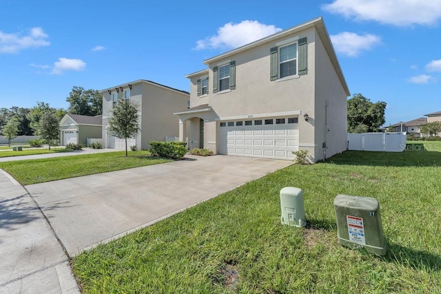 view of front property featuring a front lawn and a garage