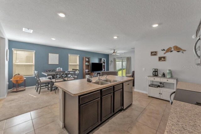 2557 Shamrock St, Tavares, FL 32778 - kitchen with a sink, dishwasher, light tile patterned flooring, ceiling fan, and open floor plan