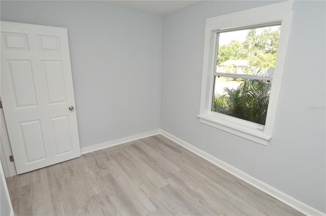 spare room featuring light wood-type flooring