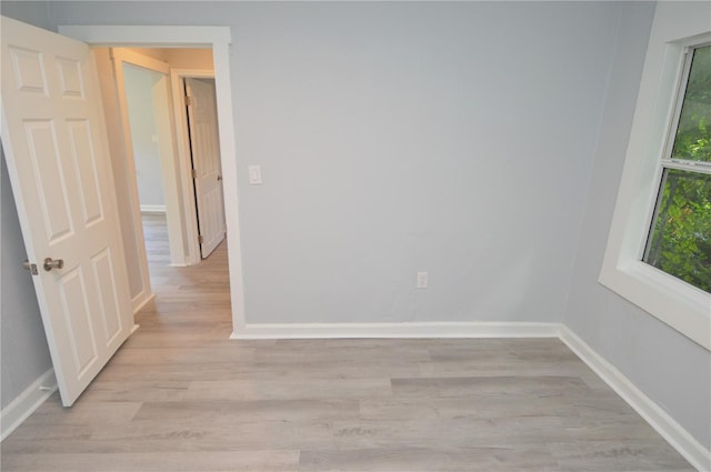 empty room with light hardwood / wood-style floors