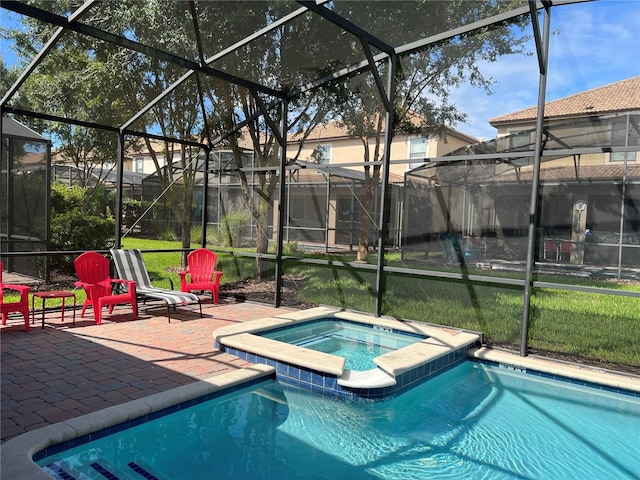 view of swimming pool with glass enclosure, an in ground hot tub, and a patio area