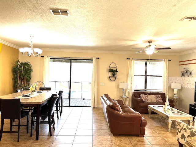 living room with plenty of natural light, visible vents, and ornamental molding