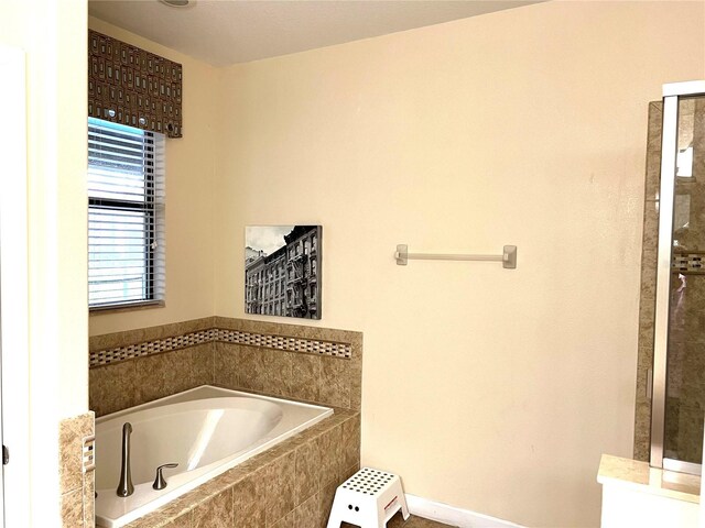 bathroom featuring plus walk in shower