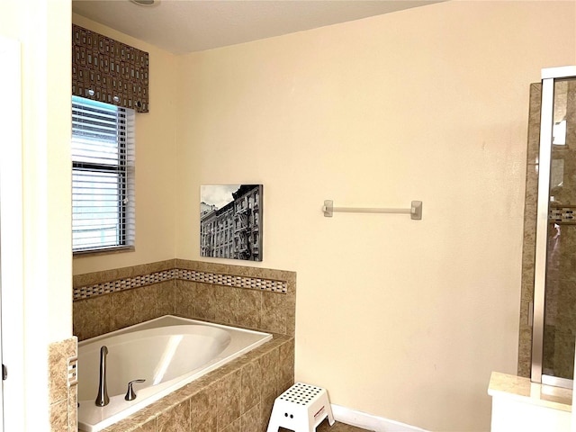 full bath with a garden tub