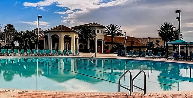 view of swimming pool with a patio area