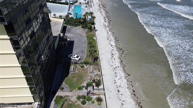 bird's eye view with a beach view and a water view