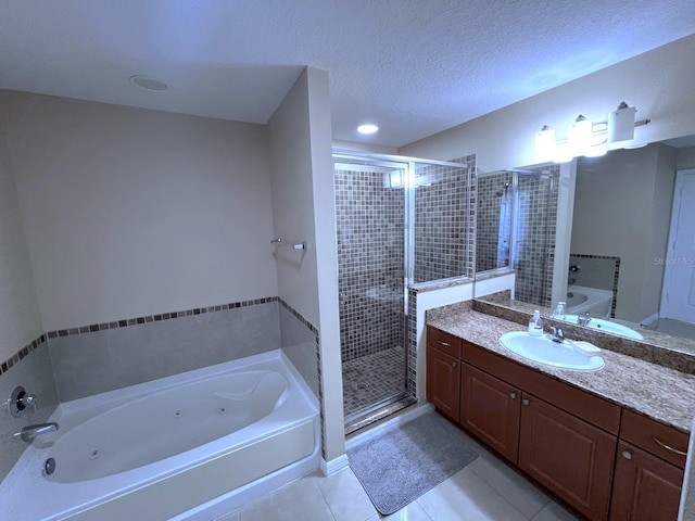 bathroom featuring vanity, a textured ceiling, separate shower and tub, and tile patterned flooring