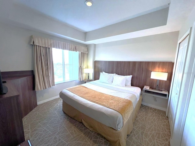 bedroom featuring wooden walls