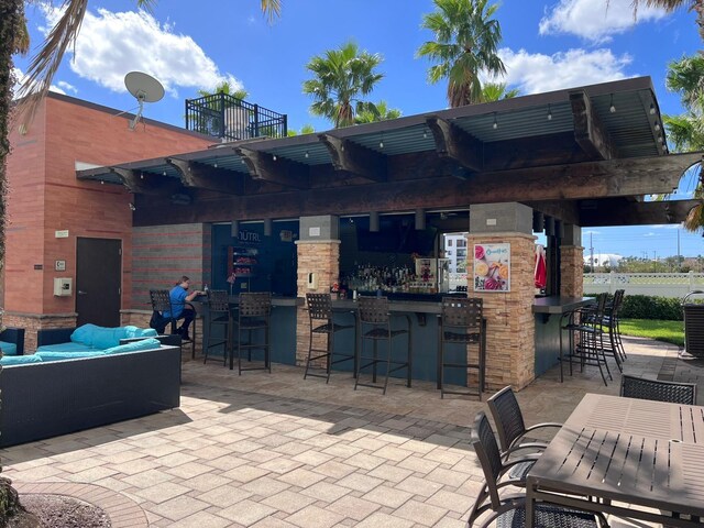 view of patio with exterior bar