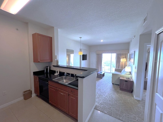 kitchen with black dishwasher, sink, kitchen peninsula, and a textured ceiling