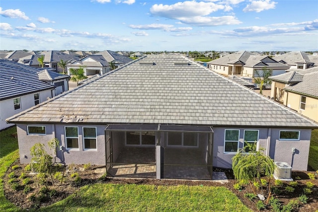 rear view of house with a sunroom