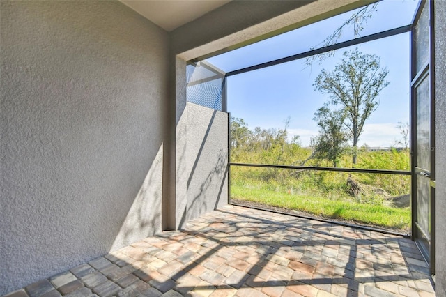 unfurnished sunroom featuring plenty of natural light