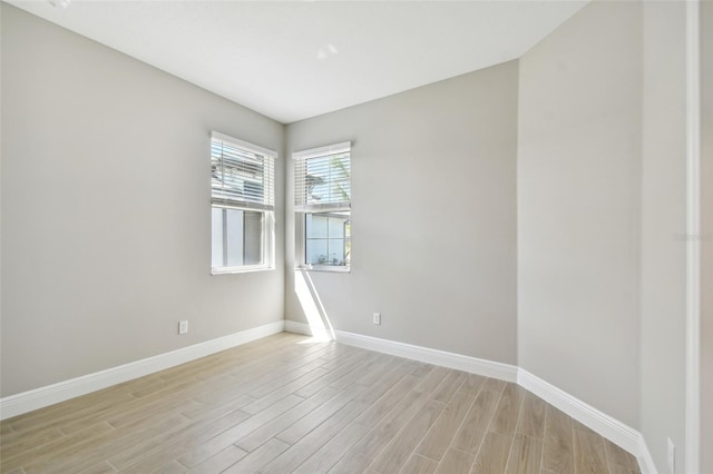 spare room with light hardwood / wood-style floors