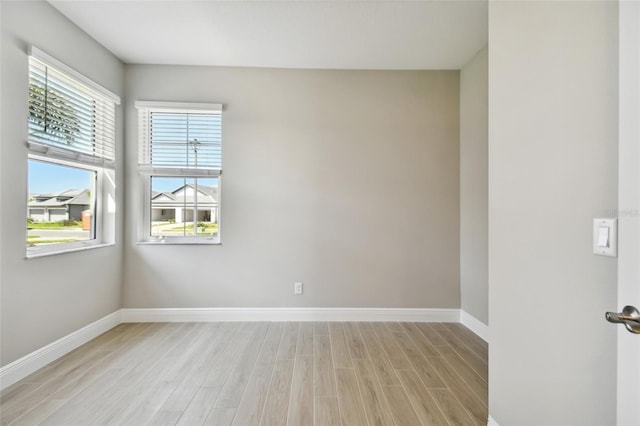 unfurnished room featuring light hardwood / wood-style floors