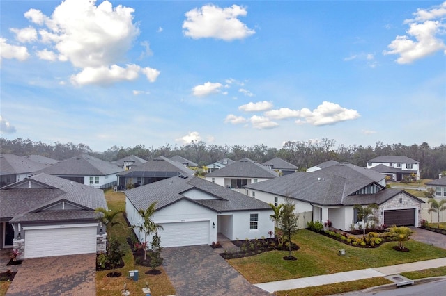 view of front of property featuring a garage and a front yard