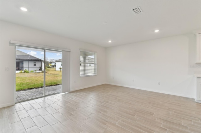 unfurnished room featuring light hardwood / wood-style floors