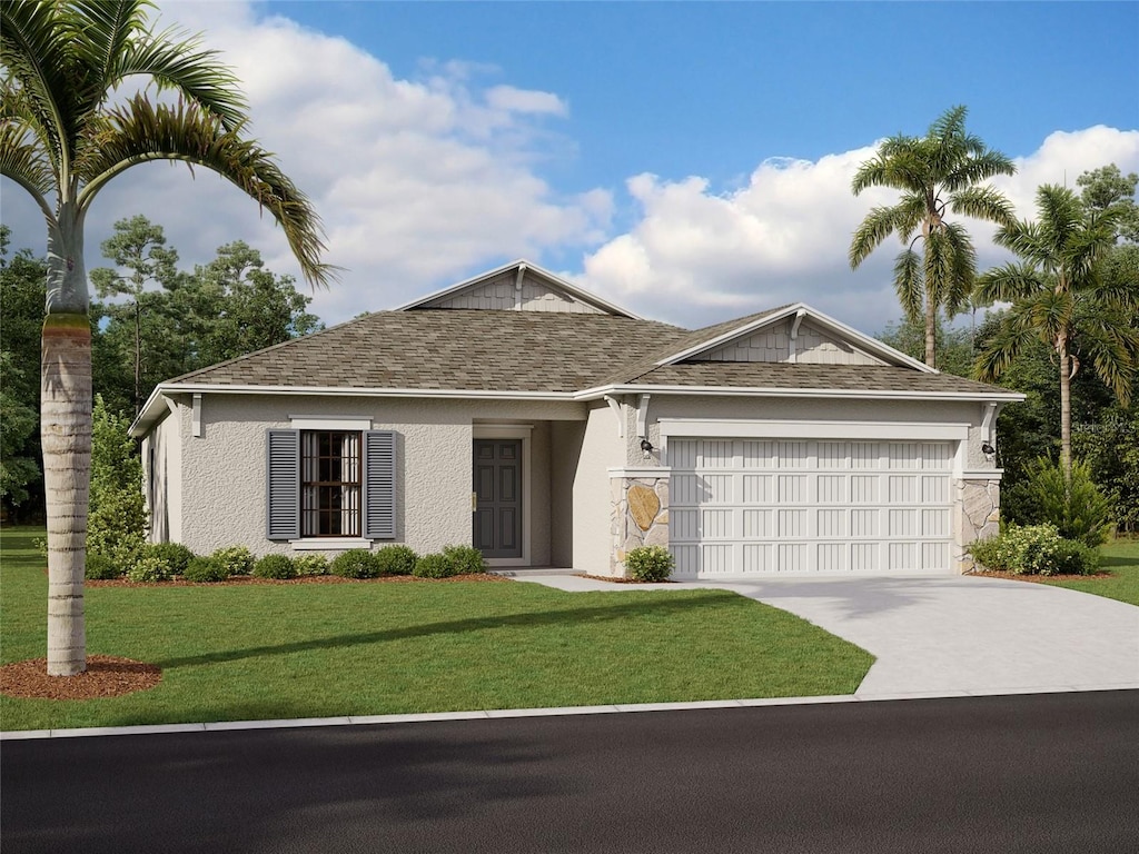 ranch-style house featuring a front yard and a garage