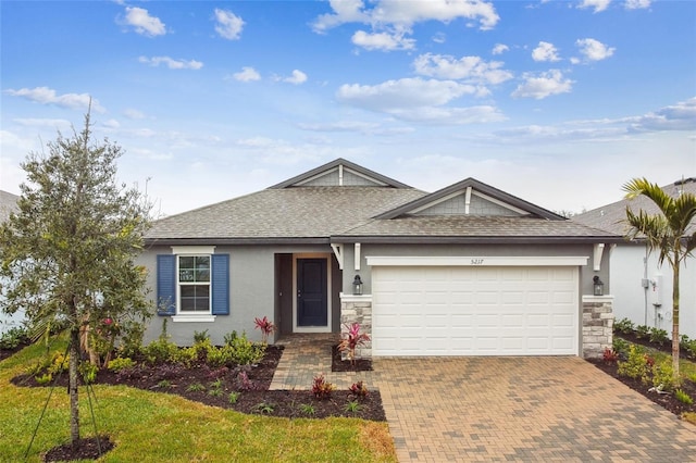 ranch-style house featuring a garage and a front lawn