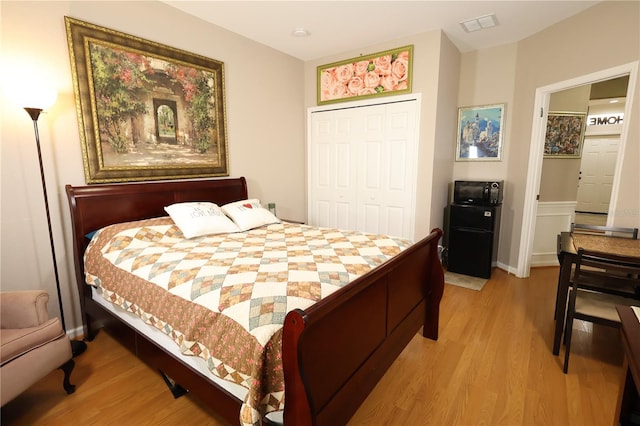 5002 Tideview Cir Unit 3, Orlando, FL 32819 - bedroom with a closet, wood finished floors, and visible vents