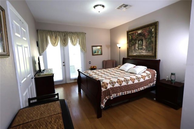 5002 Tideview Cir Unit 3, Orlando, FL 32819 - bedroom with access to outside, french doors, wood finished floors, and visible vents