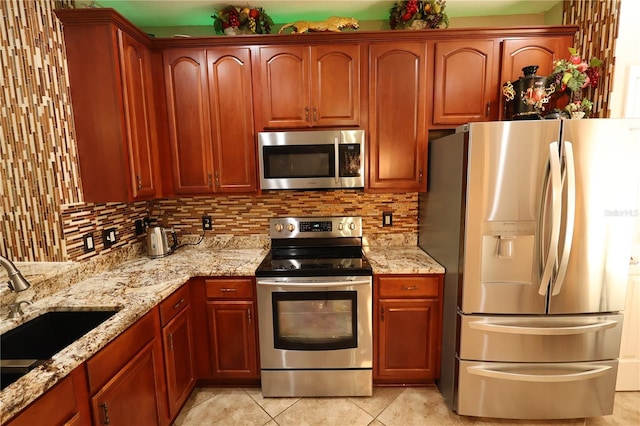 5002 Tideview Cir Unit 3, Orlando, FL 32819 - kitchen with a sink, appliances with stainless steel finishes, light tile patterned floors, and tasteful backsplash
