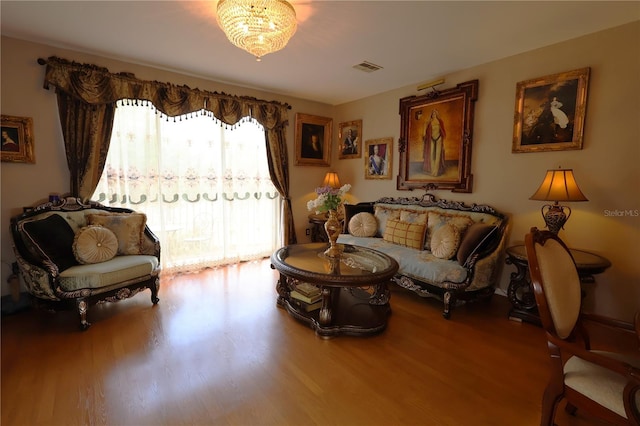 5002 Tideview Cir Unit 3, Orlando, FL 32819 - sitting room featuring visible vents, wood finished floors, and a chandelier