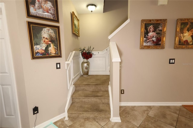 5002 Tideview Cir Unit 3, Orlando, FL 32819 - staircase with baseboards and tile patterned flooring