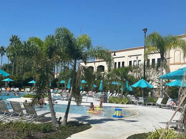 5002 Tideview Cir Unit 3, Orlando, FL 32819 - view of home's community with a pool and a patio