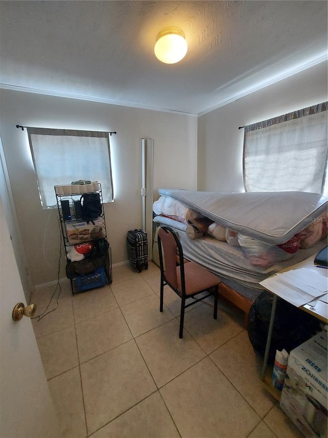 tiled bedroom with ornamental molding