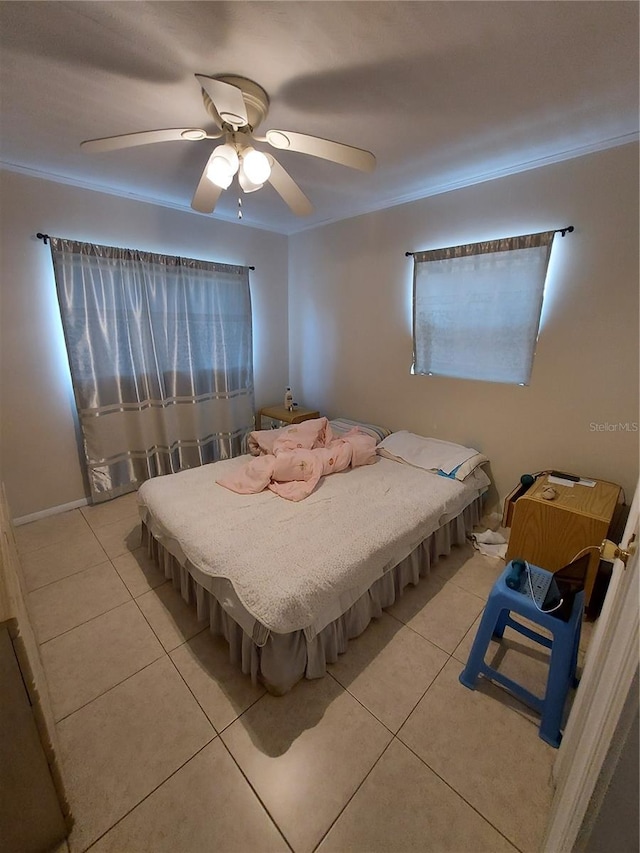 bedroom featuring ceiling fan and light tile patterned flooring