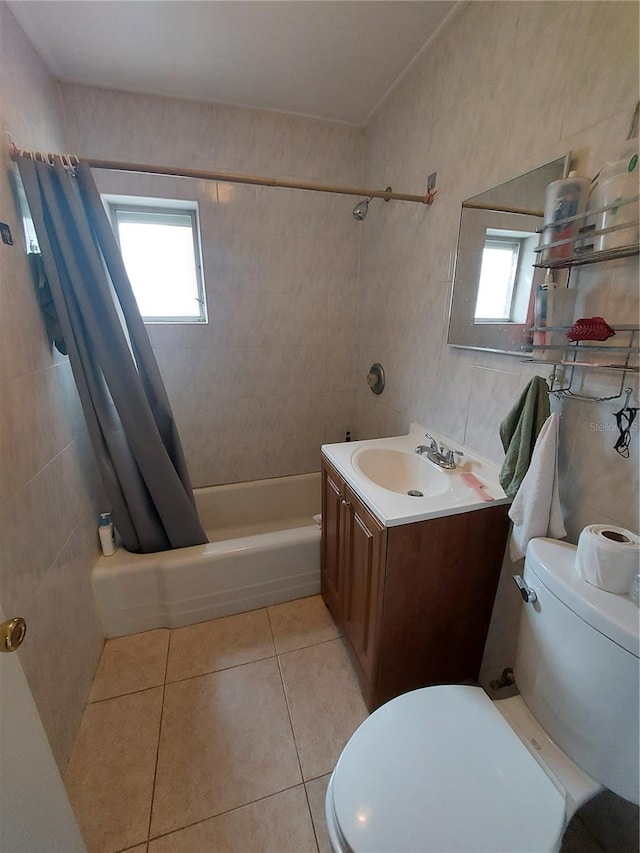 full bathroom with toilet, vanity, and plenty of natural light