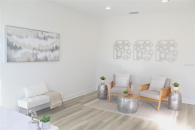 sitting room featuring light hardwood / wood-style floors