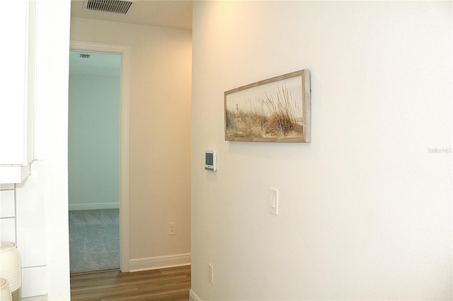 hallway featuring dark hardwood / wood-style floors