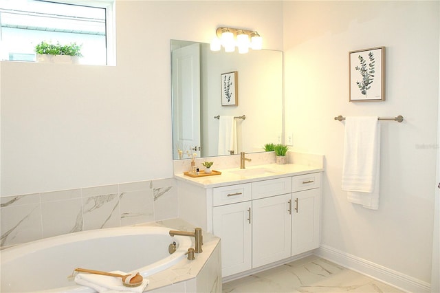 bathroom with a relaxing tiled tub and vanity