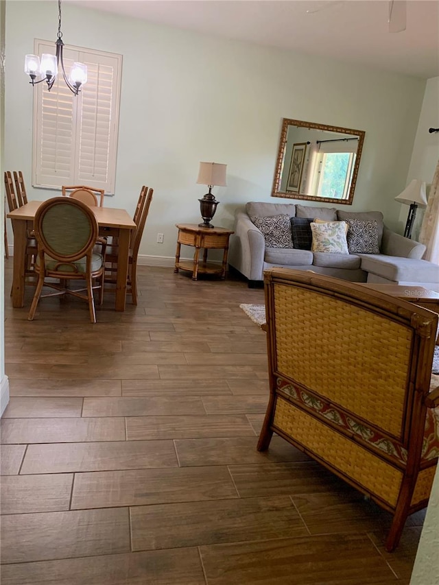 living room featuring a chandelier and hardwood / wood-style flooring