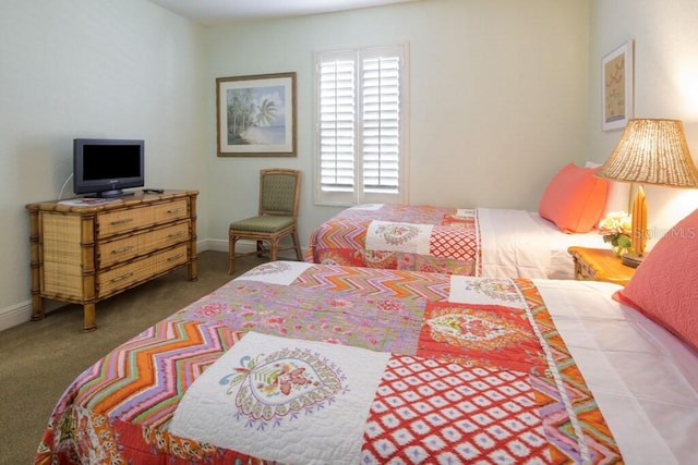 bedroom featuring carpet floors and baseboards