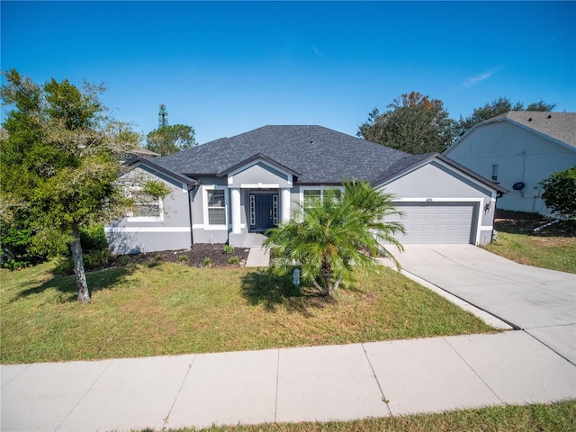 single story home featuring a garage and a front yard